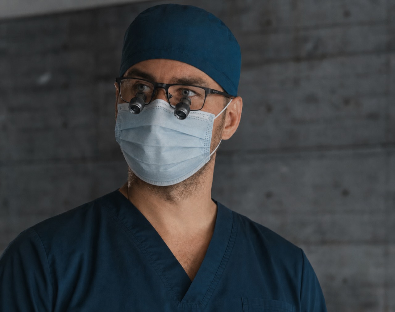 Cardiac surgeon wearing surgical loupes